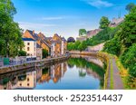 Citadel of Namur Citadelle de Namur stone fortress on hill, Sambre river embankment promenade with old colorful buildings and green trees in Namur historical city centre, Wallonia Region, Belgium