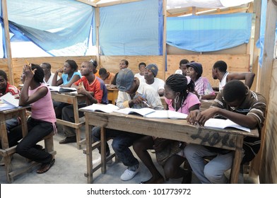 CITE SOLEIL- AUGUST 25:  Students of all ages attending classes in a local community school in CitÃ?Â© Soleil- one of the poorest area in the Western Hemisphere on August 25 2010 in Cite Soleil, Haiti.