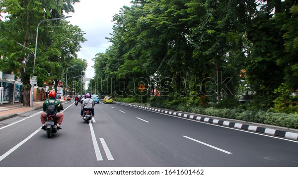 citizen activities on the streets of\
Surabaya, East Java Indonesia, February 8,\
2020