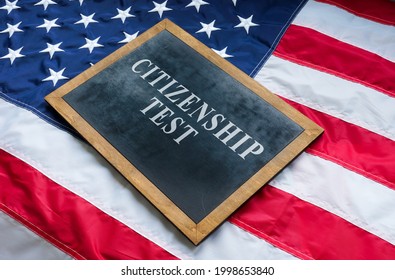 Citizenship Test On The Blackboard And USA Flag.