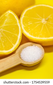 Citric acid on a yellow background. Selective focus. - Shutterstock ID 1754539559