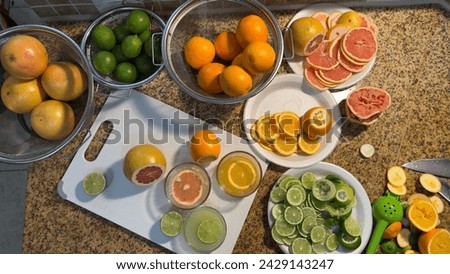 Citrus Elegance: Artfully Arranged Oranges, Grapefruits, and Lemons with Fresh Juice