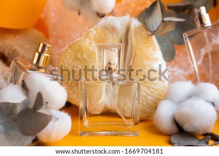 citrus flavor concept. perfume for women with notes of orange, mandarin, pamela and lemon, perfume bottles
