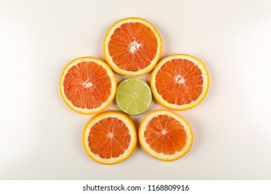 Citrus Flower Made Of Citrus Fruits, Blood Orange And Lime. Food Art Creative Concepts. Isolated On White Background.