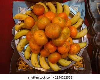 Citrus Fruits And Bananas Arranged In A Unique Way On A Stainless Steel Case