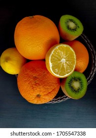 Citrus Fruits In A Bowl - Oranges, Lemons, Kiwi And Grapefruit