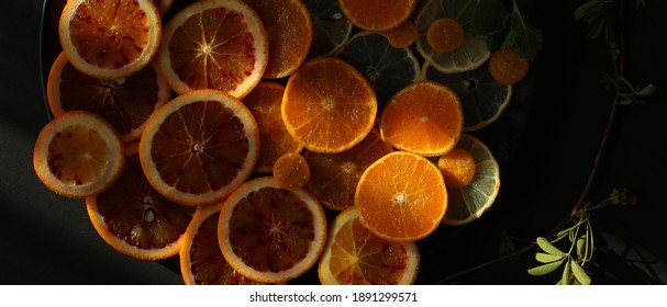 Citrus Fruits Collection. Artistic Dramatic Food Background With Different Citrus Fruits, Orange, Lime Under Sun Light