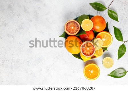 Citrus fruits, Frame made of Different sliced citrus fruits on wooden plat, fruit set with lemon, lime, orange and grapefruit isolated on white background, Various citrus fruits with a drink on table.