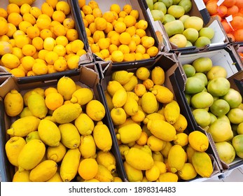 A Lot Of Citrus Fruits On Market Counter. Top View