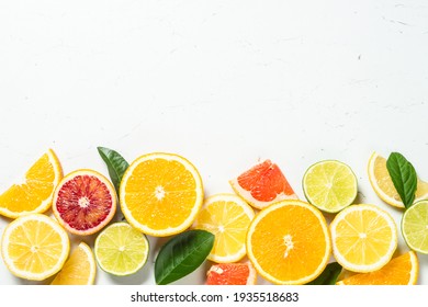Citrus fruits at white background.