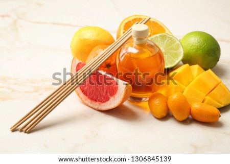 Citrus reed diffuser on table