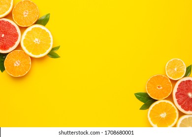 Citruses Fruits On Illuminating Pantone Colored  Background With Copyspace, Fruit Flatlay, Summer Minimal Compositon With Grapefruit, Lemon, Mandarin And Orange, Color Of Year 2021