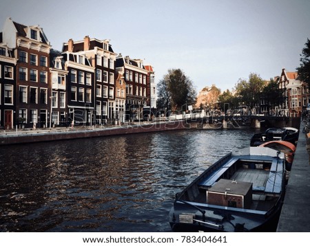 Similar – Image, Stock Photo Tranquil Amsterdam canal with iconic narrow houses