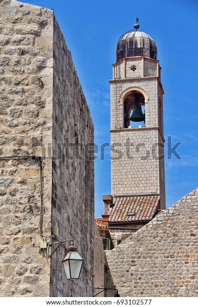 City Bell\
Tower, the tower marking the eastern end of the main drag (Strada),\
the slender dome-capped tower has a two-tonne bell and a large\
curvy clockface, Dubrovnik,\
Croatia