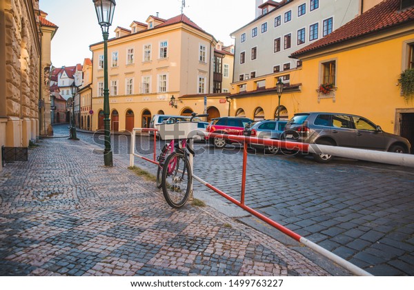 city bike parked at roadside in european city.\
ecology transport.