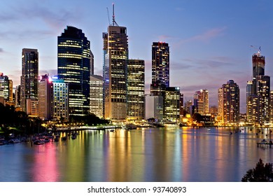 City Of Brisbane At Sunset Reflected In The River