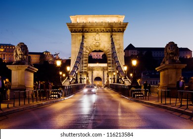 City Of Budapest In Hungary Night Urban Scenery, Street On The Szechenyi Chain Bridge (Hungarian: Szechenyi Lanchid).