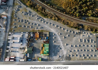 City Bus Storage And Repair Facility. Aerial Top Down View. Nobody. Small Piles Of Sand On The Ground.