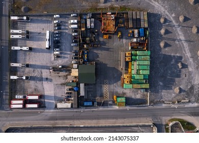 City Bus Storage And Repair Facility. Aerial Top Down View. Nobody. Small Piles Of Sand On The Ground.