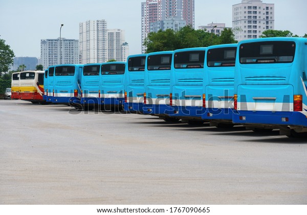 City buses in\
the parking lot at the bus\
station