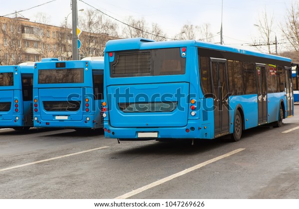city buses\
in the Parking lot near the bus\
station