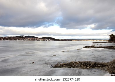 The City Of Östersund By The Frozen Lake Storsjön On A Cold March Day In Sweden.