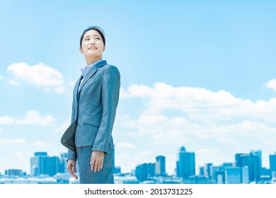 City Center, Blue Sky And Young Business Woman