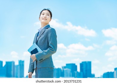 City Center, Blue Sky And Young Business Woman