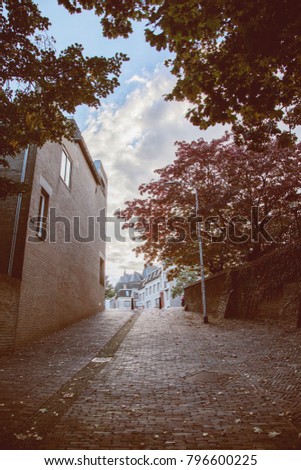 Similar – schmale Gasse führt zu einem Kirchengebäude