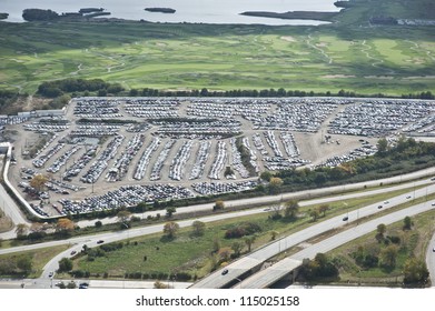 The City Of Chicago Impound Lot For Vehicles On A Cloudy Day.