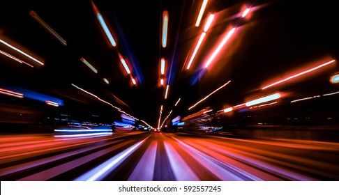 City colorful night lights perspective blurred by high speed of the car. A streak of light, trails. - Shutterstock ID 592557245