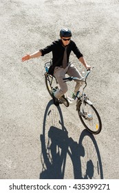 City Commuter On Electric Bicycle, Signalling Before Right Turn