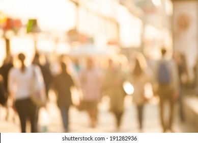 City commuters. High key blurred image of workers going back home after work. Unrecognizable faces, bleached effect.
