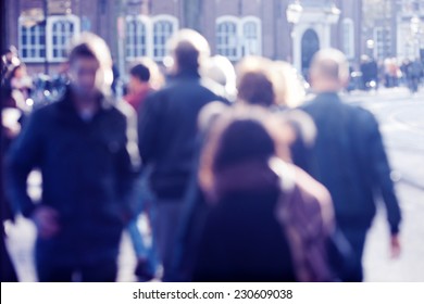 City Commuters. High Key Blurred Image Of People Walking In The Street. Unrecognizable Faces.