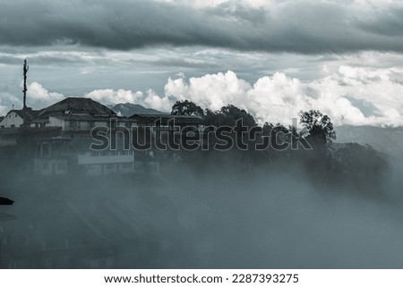 a city covered  with clouds