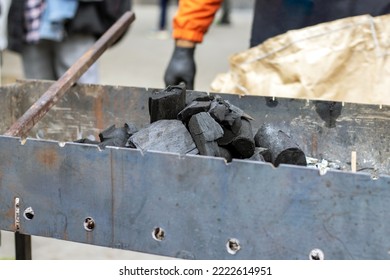 City Day National Holiday Cook Man Woman Prepare Food In Middle Of Street Road Lightning Fire Putting Coal Black In Barbeque Grill.tasty Delicious Street Food Outside Outdoor