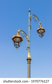 City decorative street lantern on blue sky background. Urban metal lamppost in Marrakesh, Morocco