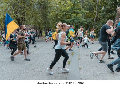 In The City Of Dnipro, A Race Was Held In Support Of The Defenders Of Mariupol. Running For Azovstal. Sports Flash Mob. DNIPRO, UKRAINE - 13 July 2022