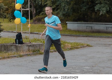 In The City Of Dnipro, A Race Was Held In Support Of The Defenders Of Mariupol. Running For Azovstal. Sports Flash Mob. DNIPRO, UKRAINE - 13 July 2022