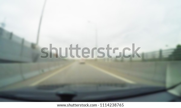 City Driving theme blur background view
through car windshield