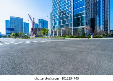 city empty traffic road with cityscape in background - Shutterstock ID 1018254745
