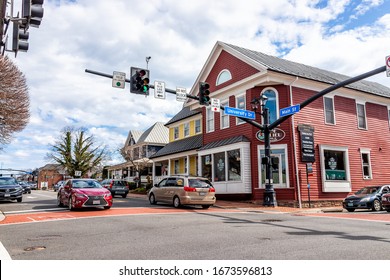 City of Fairfax, USA - March 10, 2020: Downtown old town at University drive, Main street intersection with stores, shops and restaurants in Fairfax county with office buildings in Northern Virginia