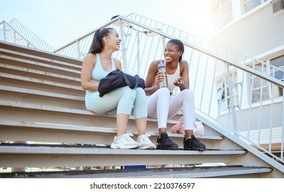 City Fitness, Relax And Friends On Stairs After Running For Cardio With Water Together In Australia. African Runner Women With Smile, Laughing And Happy After Outdoor Workout And Exercise Training