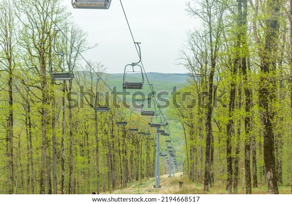 The\
city of Goryachy Klyuch, chairlifts in the forest. A cable car for\
climbing to the top of the mountain without\
people.