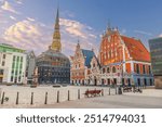 City Hall Square with House of the Blackheads and Saint Peter church in Old Town of Riga, Latvia’s capital at sunset