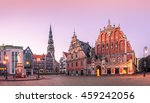 City Hall Square with House of the Blackheads and Saint Peter church in Riga Old Town During sunset time.