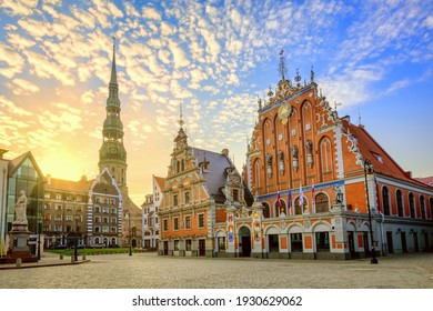 City Hall Square with House of the Blackheads and Saint Peter church in Old Town of Riga on dramatic sunrise, Latvia