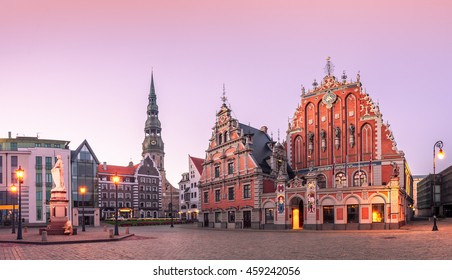 City Hall Square with House of the Blackheads and Saint Peter church in Riga Old Town During sunset time.
