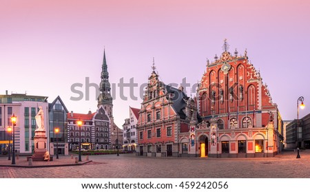 City Hall Square with House of the Blackheads and Saint Peter church in Riga Old Town During sunset time.