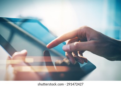 City and hands using tablet with sun light - Powered by Shutterstock